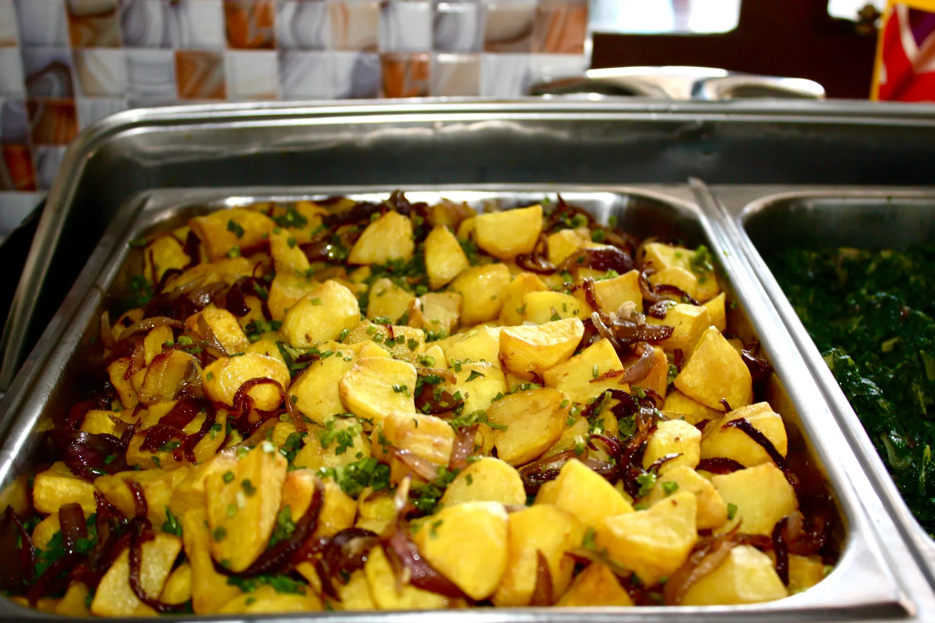 Large-format conference buffet tray prepared for a full-day session